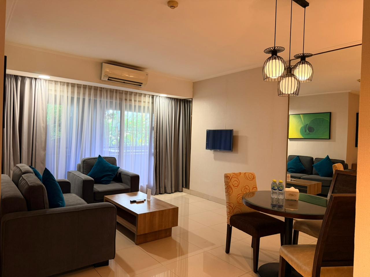 Grand Tropic Suites Hotel - Tap to explore photos